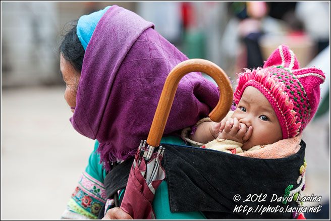 Yi Woman And Baby - Tribal Local Market, China