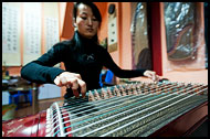 Playing Guzheng, Jianshui, China